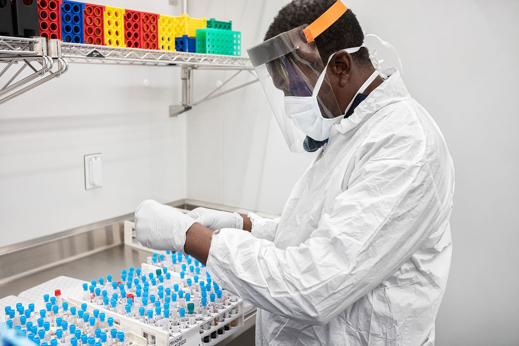  (A research assistant works with live COVID-19 specimens at Downstate Health Sciences University's biobank on April 20, 2020, in the Brooklyn, New York.)