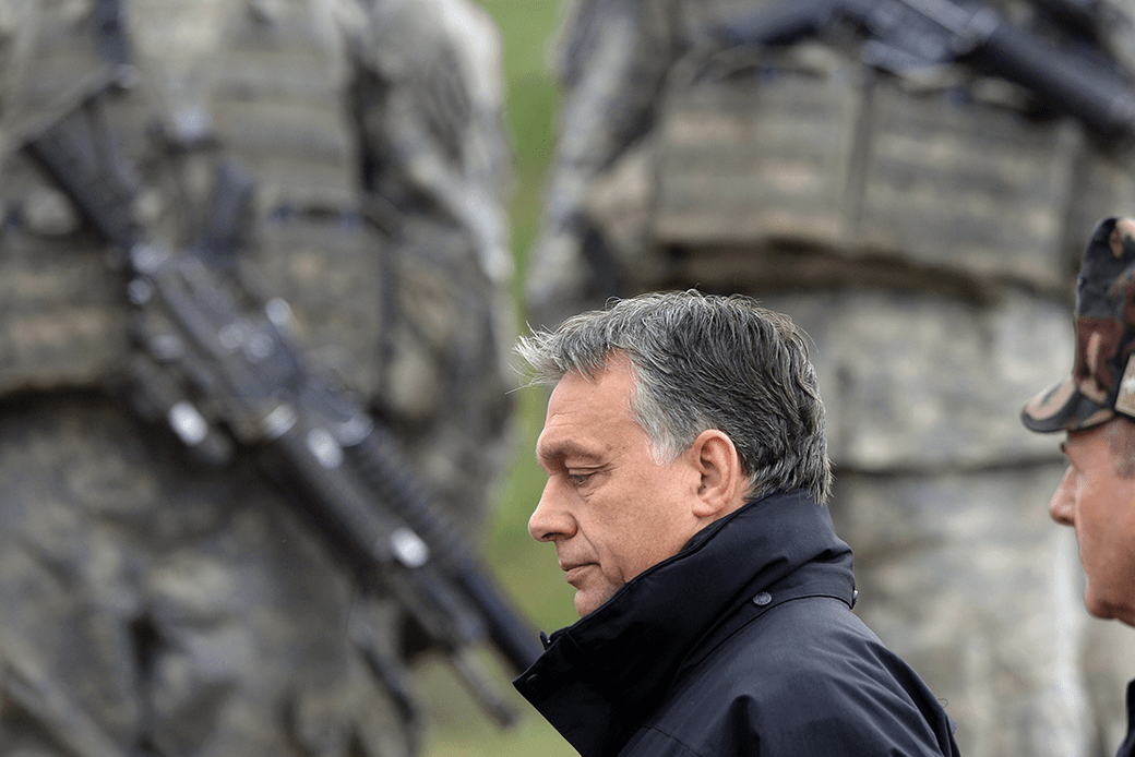 Hungarian Prime Minister Viktor Órban walks in front of U.S. soldiers after a joint military exercise near the Osku village in Hungary, October 2014. (Getty/Attila Kisbenedek/AFP)