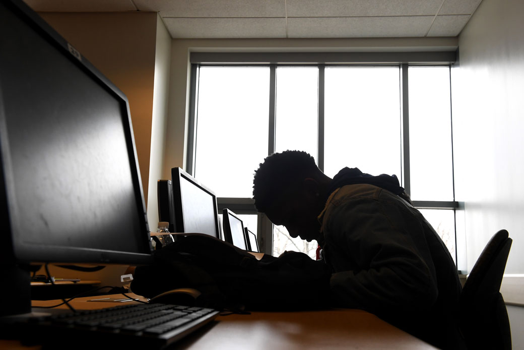 A recent high school graduate works on a reading assignment for a noncredit class at a community college in Takoma Park, Maryland, February 2020. (Getty/The Washington Post/Katherine Frey)