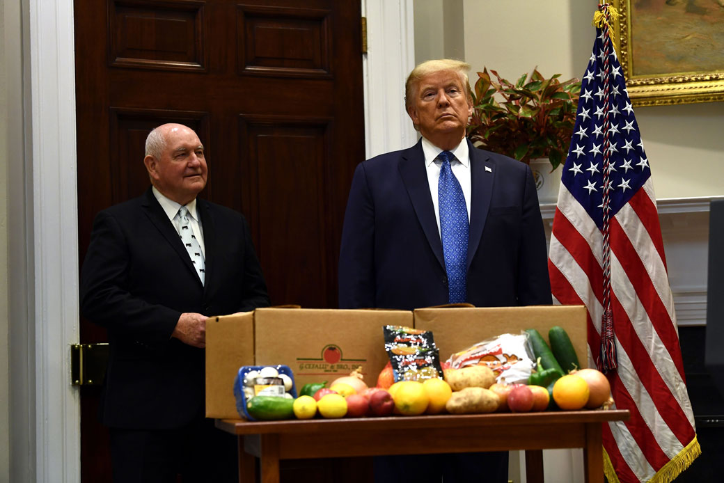 President Donald Trump and Secretary of Agriculture Sonny Perdue attend an event in the White House about the food supply chain during the coronavirus pandemic, May 2020. (Getty/Brendan Smialowsk /AFP)