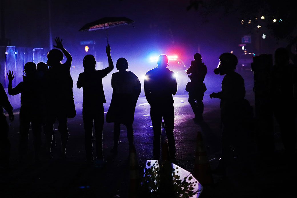 (People gather to protest in front of the Mark O. Hatfield federal courthouse in downtown Portland, Oregon, on July 27, 2020.)
