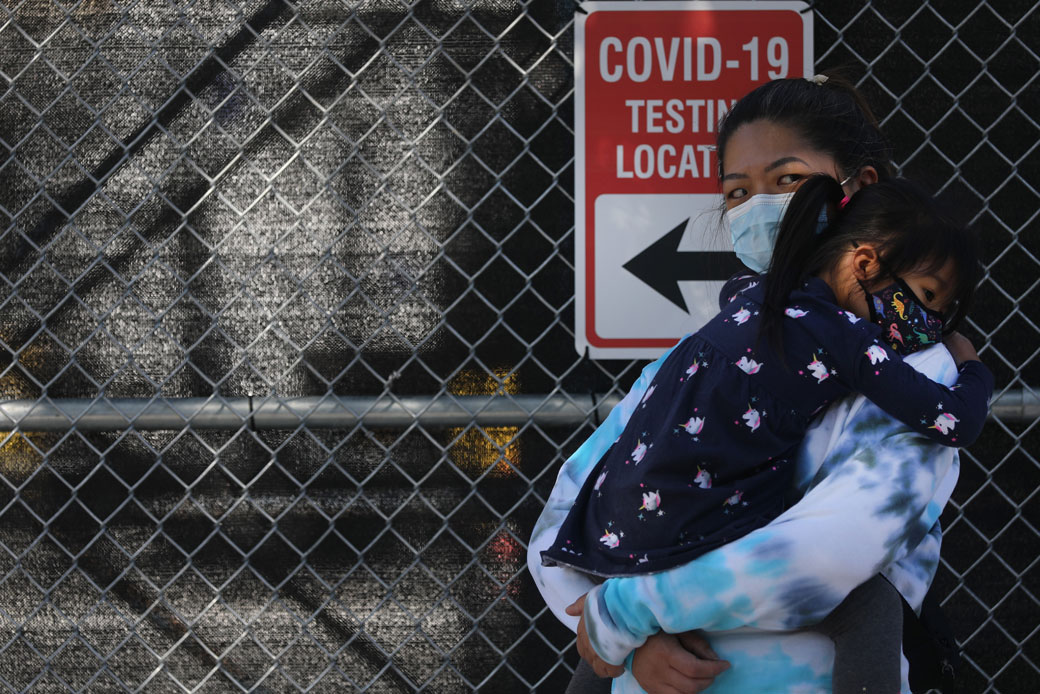 A mother and daughter wait in line to be tested for COVID-19 at a city test site in Brooklyn, New York, October 2020. (Getty/Spencer Platt)