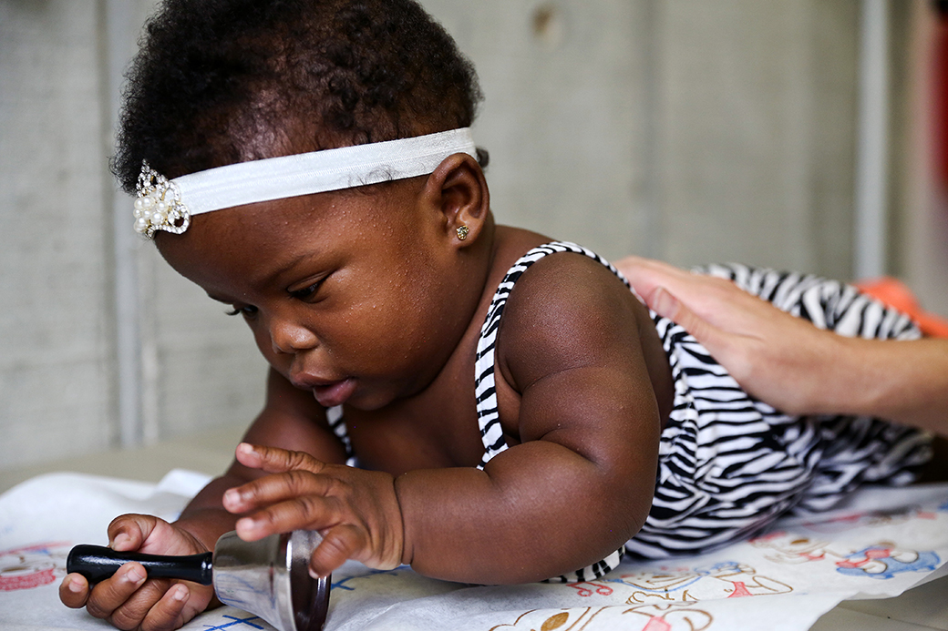 An infant is seen during her development evaluation at a health center, 2016. (Getty/Scott McIntyre)