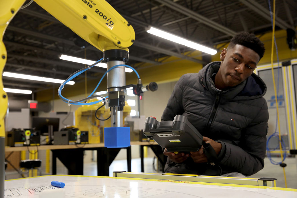  (A student uses a robot at a Midwestern technical college on February 13, 2020.)