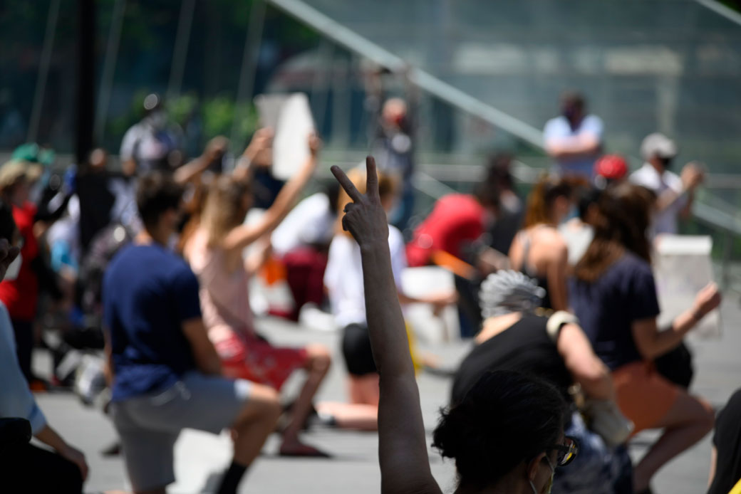  (Philadelphians take a knee during a protest against police brutality in Philadelphia, May 2020.)