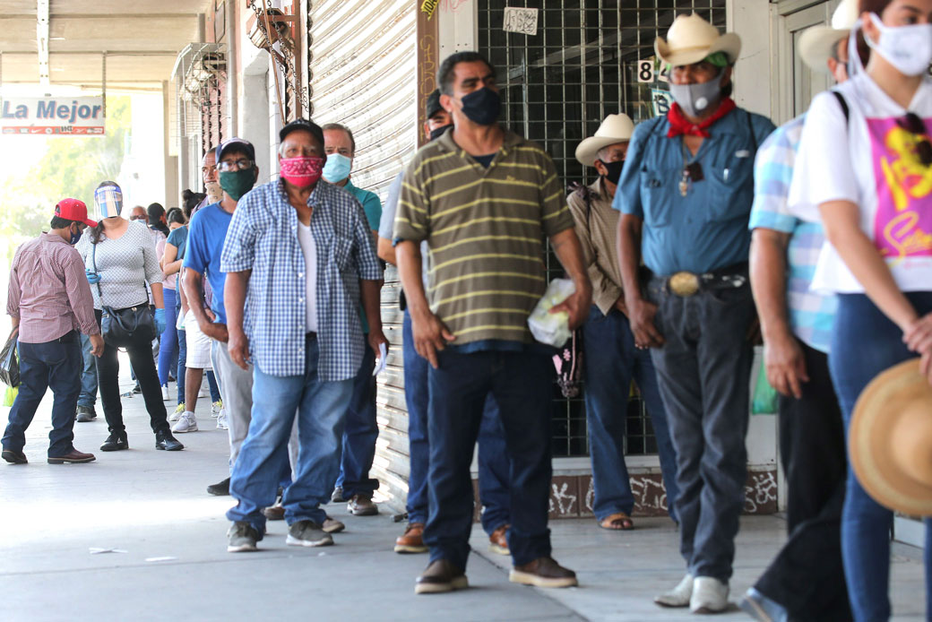 People wait in line to fill out unemployment forms near the U.S.-Mexico border in Calexico, California, which has been hard-hit by the COVID-19 pandemic, on July 24, 2020. (Getty/Mario Tama)