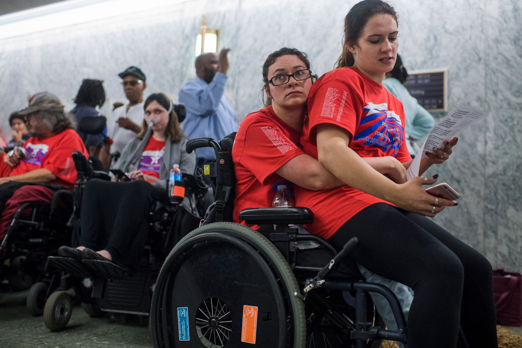Sisters wait in line for a Senate Finance Committee hearing on the proposal to repeal and replace the Affordable Care Act, September 25, 2017. (Getty/Tom Williams/CQ Roll Call)