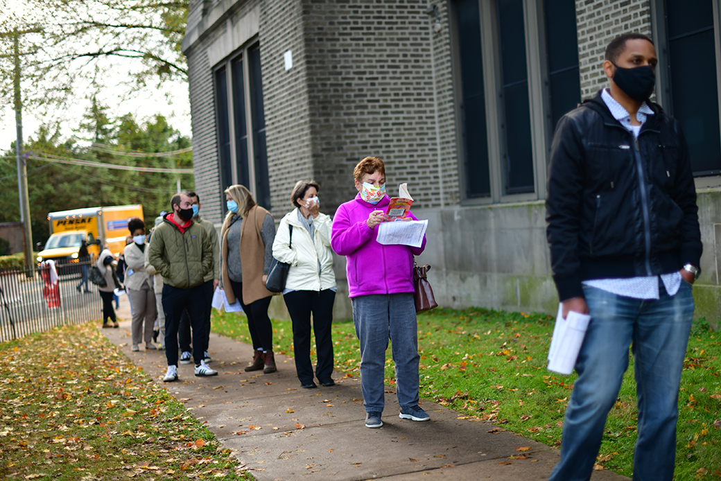 Voters stand in line outside of a satellite polling station in Philadelphia, October 2020. (Getty/Mark Makela)