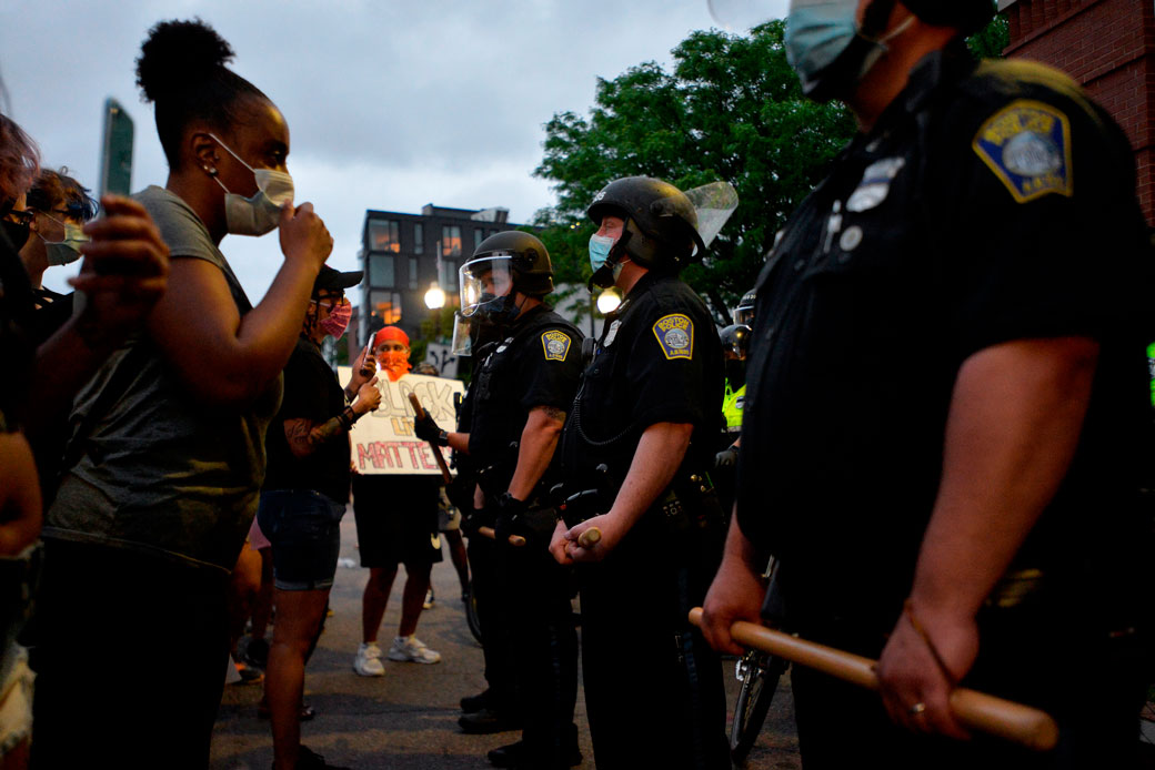 Protesters face police outside the District Four Police Station in Boston, Massachusetts, during a Black Lives Matter protest on May 29, 2020. (Getty/Joseph Prezioso)