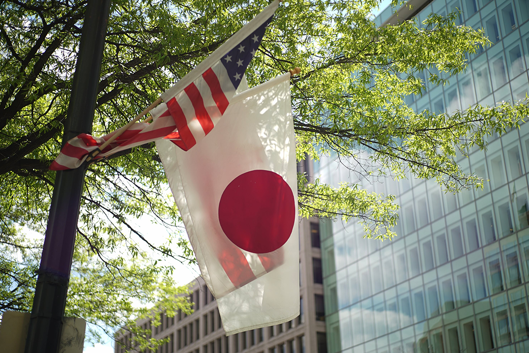 The U.S. and Japanese flags fly on a lamp post in Washington, D.C., the day before the White House hosts Japanese Prime Minister Shinzo Abe for a visit, April 2015. (Getty/Mandel Ngan/AFP)