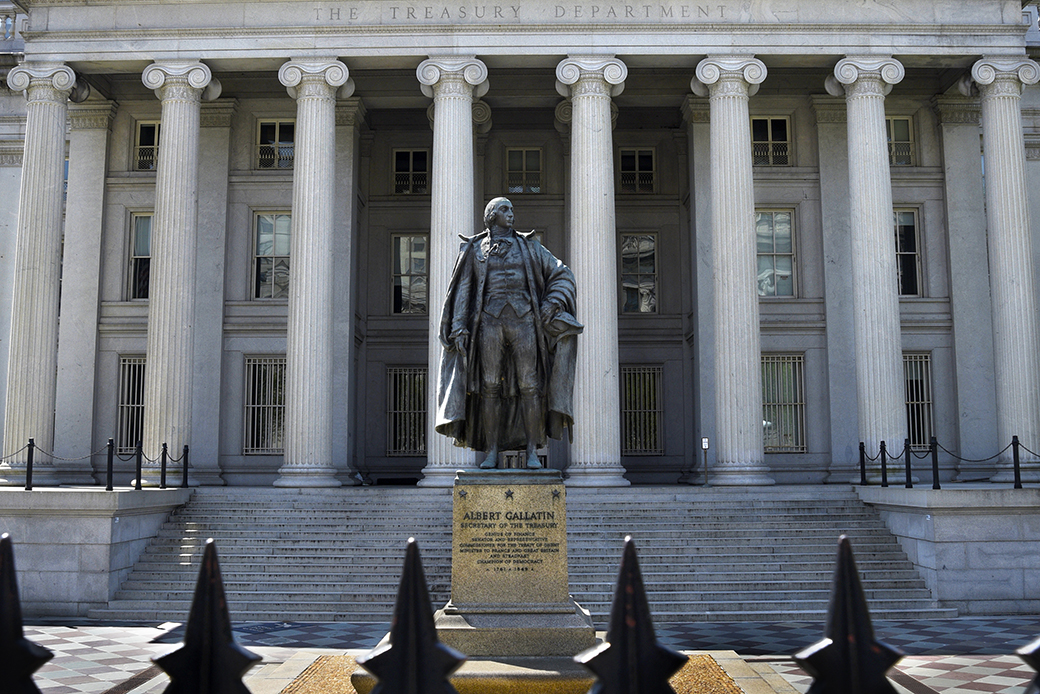 A statue of Albert Gallatin, a former U.S. secretary of the Treasury, stands in front of the Treasury Building in Washington, D.C., April 2018. (Getty/Robert Alexander)