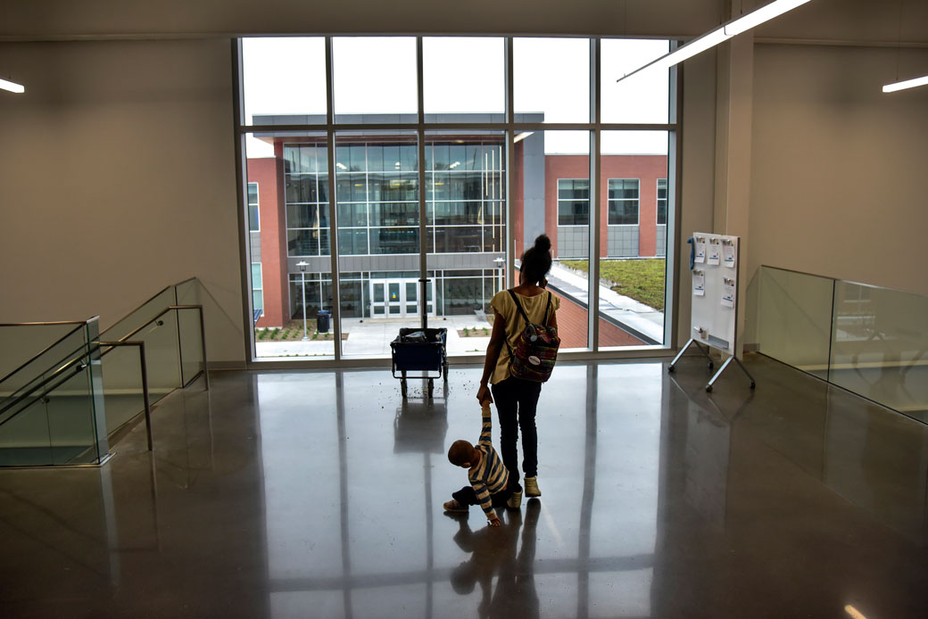 A woman and her son leave a classroom on the Fort Omaha Campus of Metropolitan Community College in Omaha, Nebraska, on May 1, 2018. (Getty/Jahi Chikwendiu/The Washington Post)