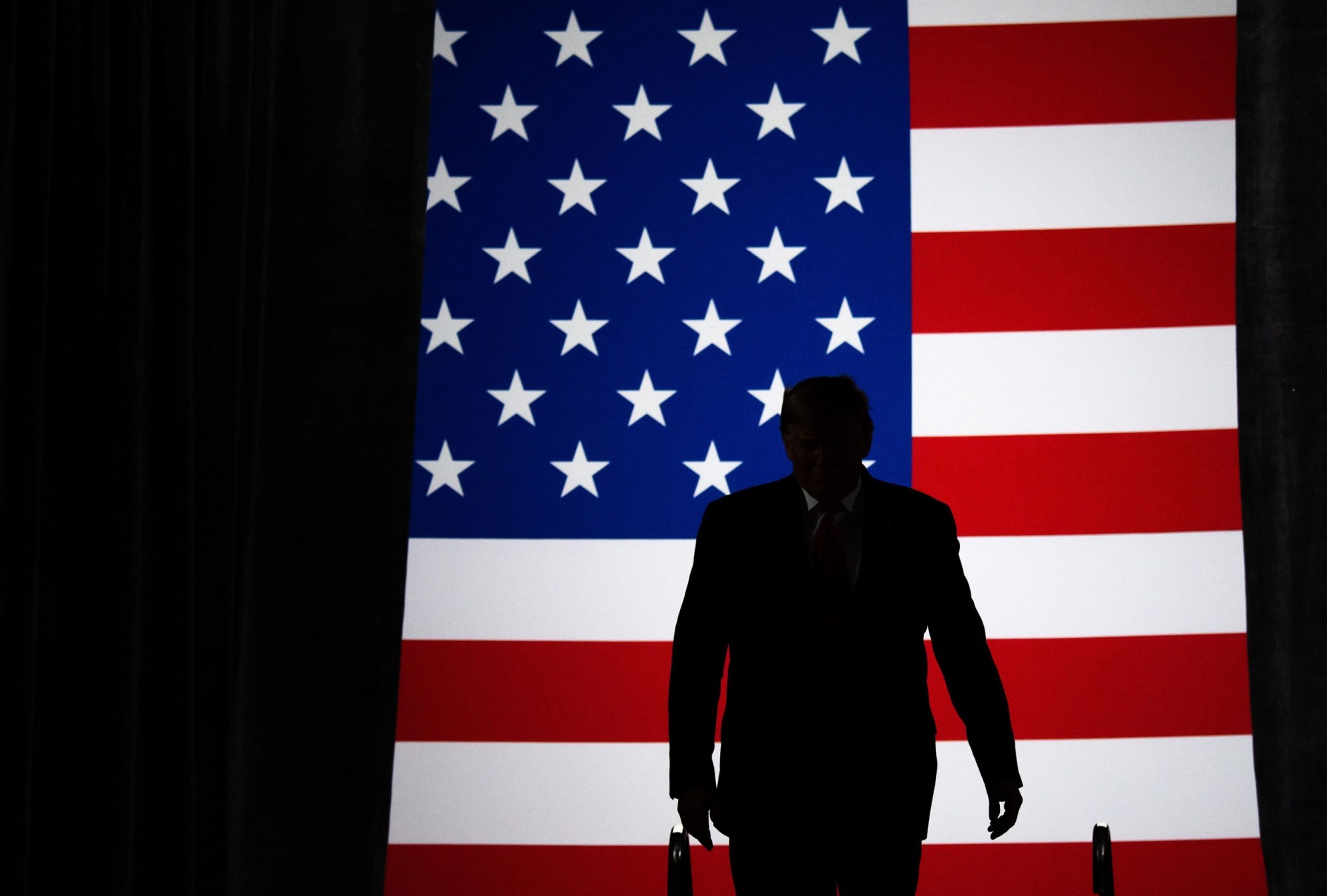 TOPSHOT - US President Donald Trump arrives for a 