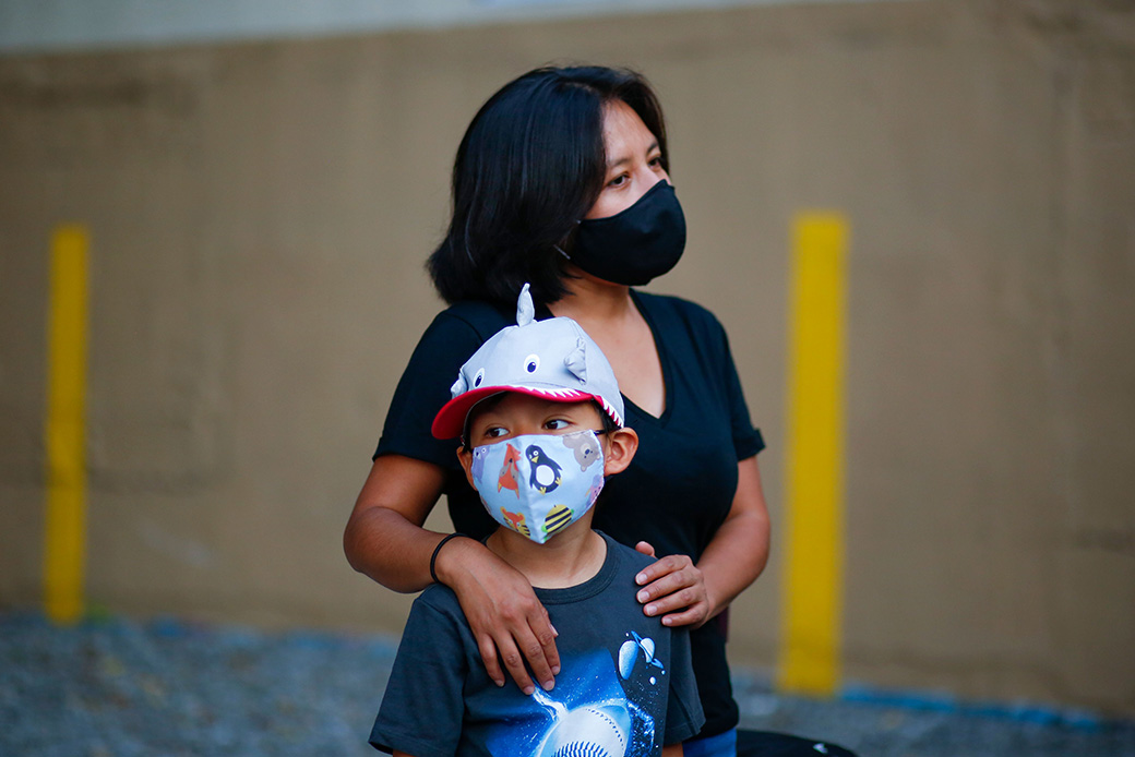 A woman and her child attend a food distribution in New York City in August 2020. (Getty/Kena Betancur/AFP)