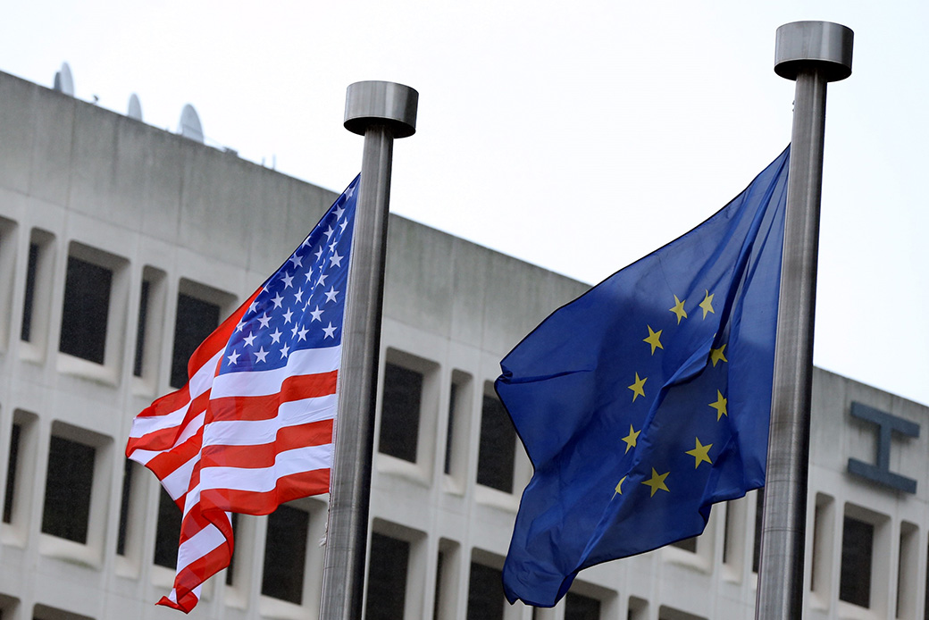 The national flag of the United States flutters with the flag of the European Union during a meeting between former U.S. Vice President Mike Pence and former European Commission President Jean-Claude Juncker in Brussels, Belgium, February 2017. (Getty/Dursun Aydemir/Anadolu Agency)