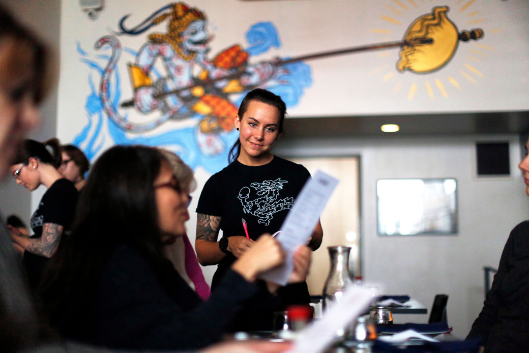 A server at a restaurant in Portland, Maine, takes a customer's order on April 26, 2017. (A server at a restaurant in Portland, Maine, takes a customer's order on April 26, 2017.)