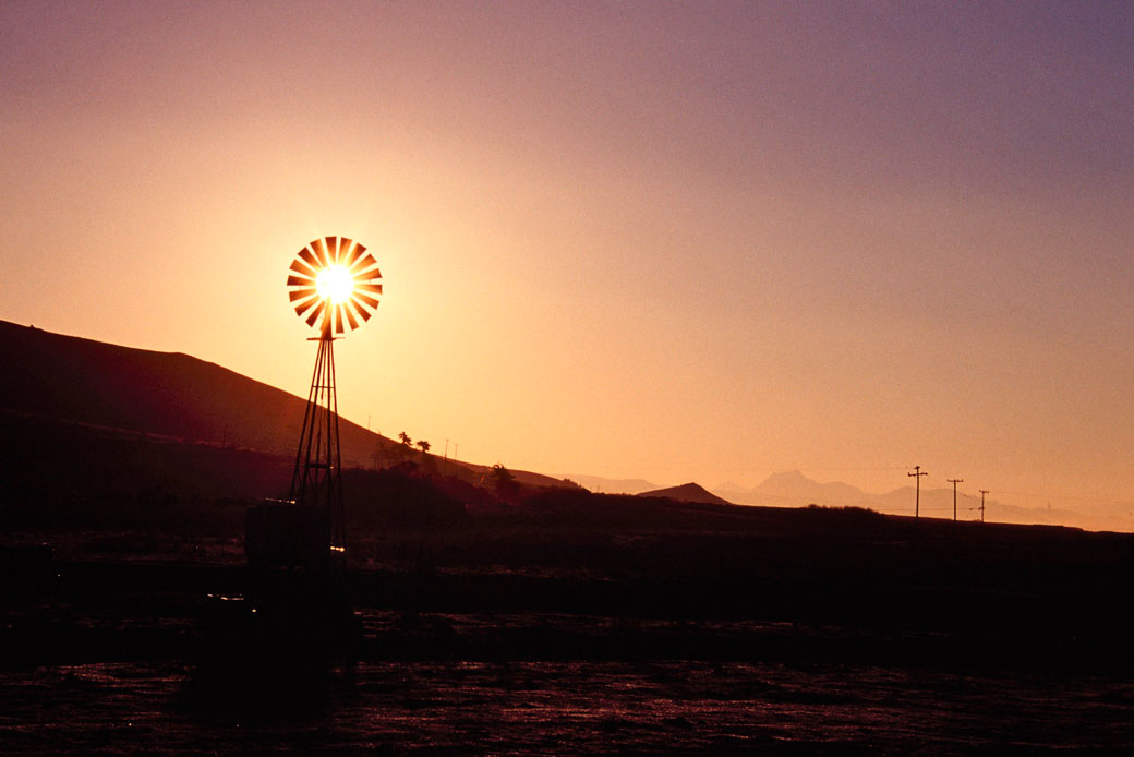 The sun shines on a wind energy generator in California, April 2007. (Getty/Construction Photography/Avalon)