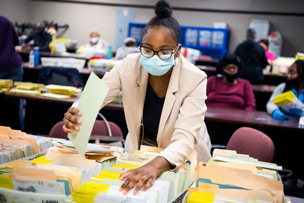 Election workers sort ballots at the Dekalb County Voter Registration and Elections Office in Decatur, Georgia, on November 2, 2020. (Getty/Tom Williams)