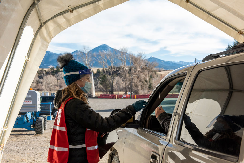  (The Park County Health Department performs COVID-19 rapid testing in Livingston, Montana, on December 7, 2020.)