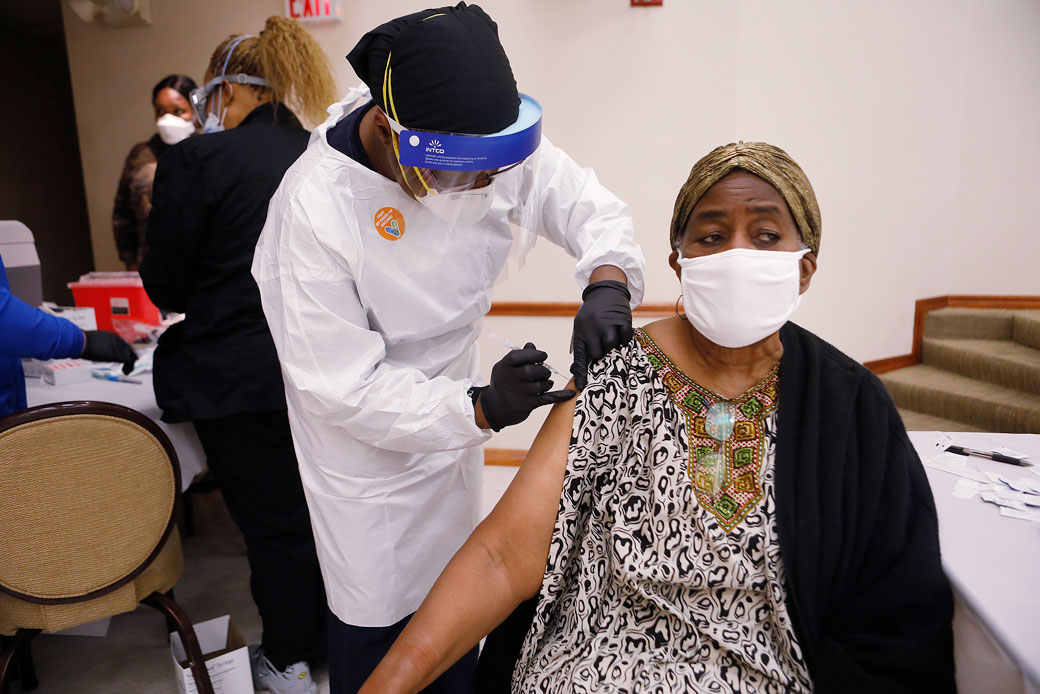 A health care worker administers the COVID-19 vaccine to a resident living in Tampa, Florida, on January 10, 2021. (Getty/Octavio Jones)