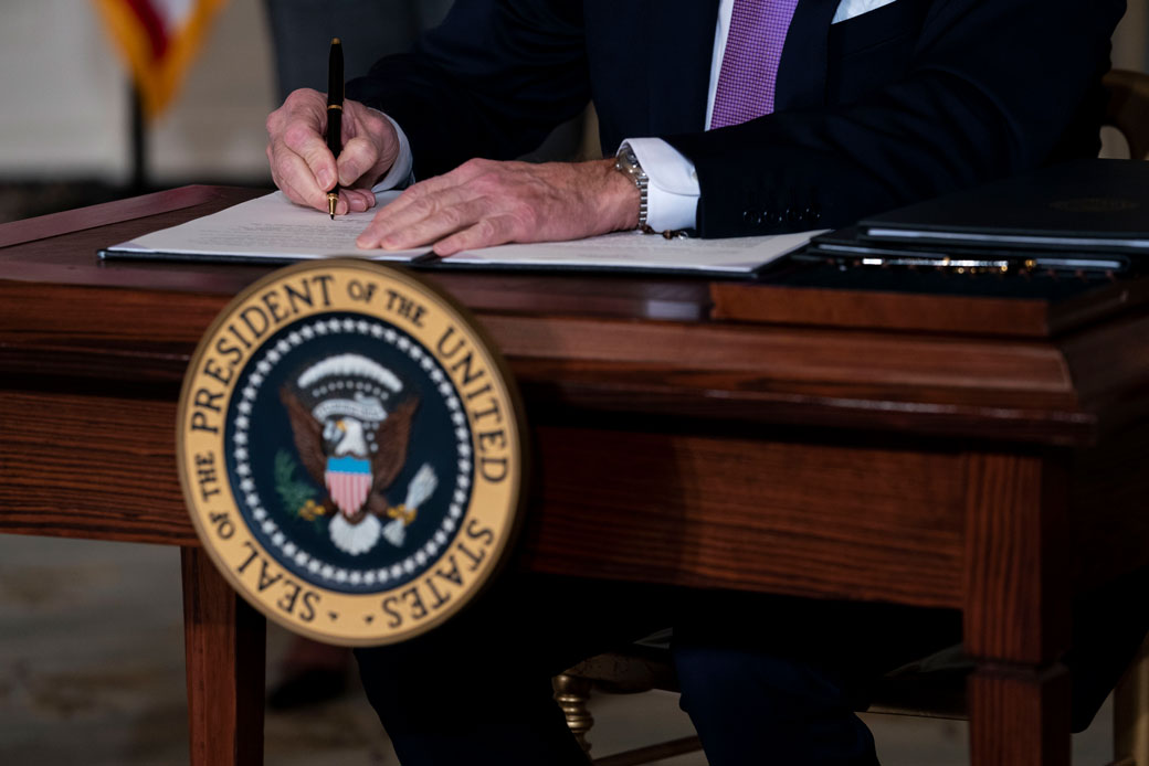 President Joe Biden signs executives orders related to his racial equity agenda on January 26, 2021, Washington, D.C. (Getty/Doug Mills-Pool)