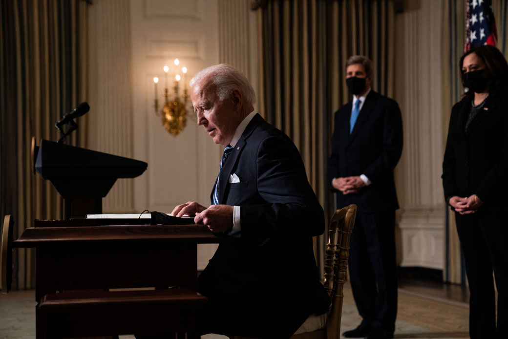  (President Joe Biden prepares to sign executive orders after speaking about climate change issues at the White House on January 27, 2021, in Washington, D.C.)