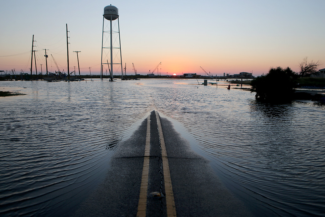 Floodwaters cover a roadway near structures damaged by Hurricane Laura on October 10, 2020, in Cameron, Louisiana. (Getty/Mario Tama)