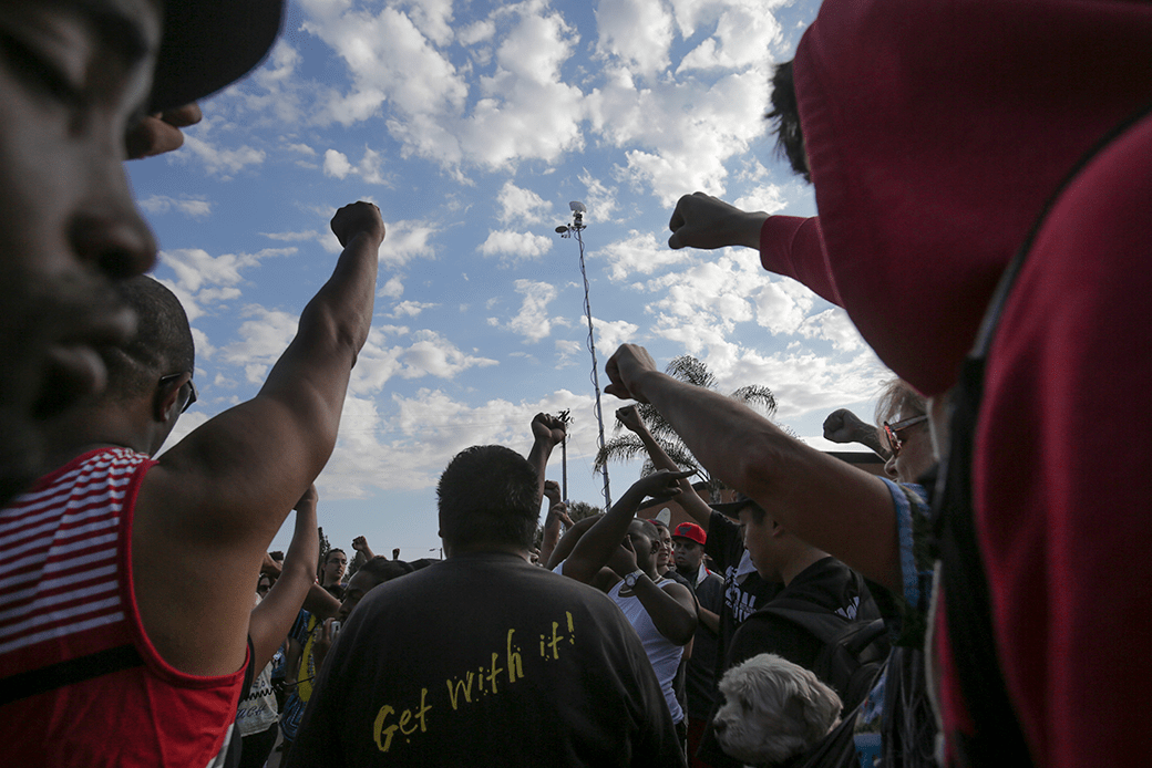 Demonstrators raise their fists during a rally in San Diego following the fatal police shooting of an unarmed Black man, identified as Ugandan refugee Alfred Olango, who was said to be mentally ill, September 2016. (Getty/Bill Wechter/AFP)