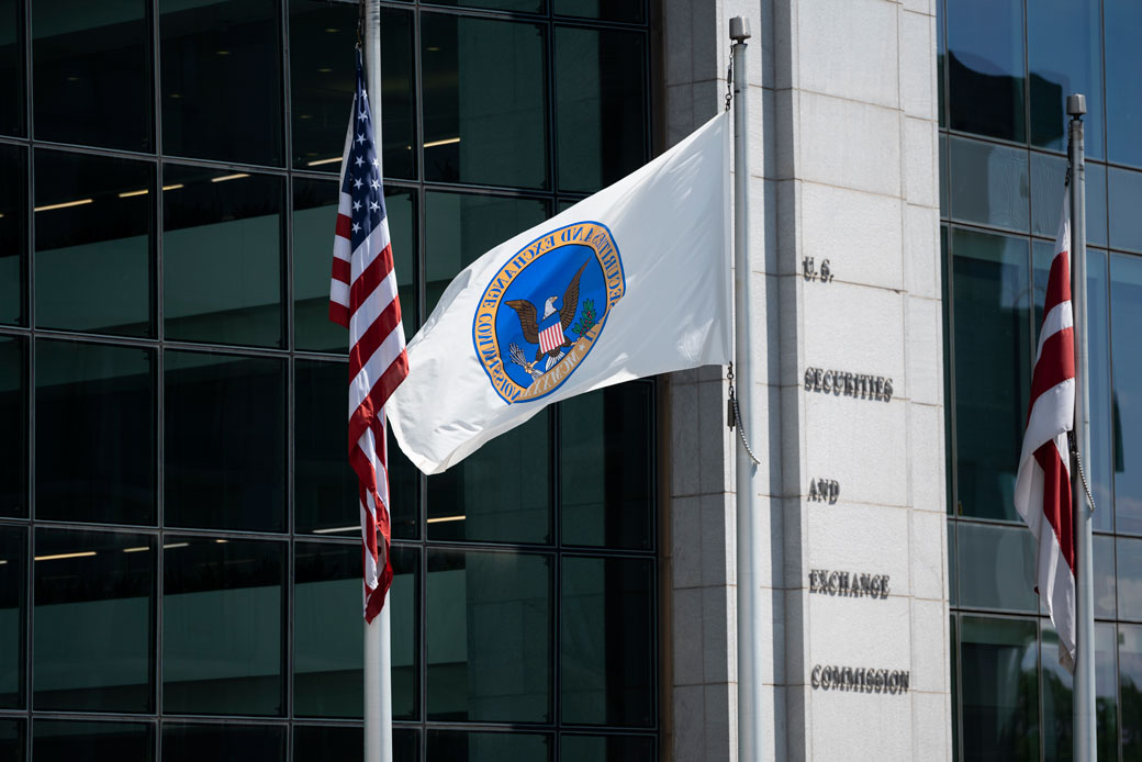 A flag flies outside of the U.S. Securities and Exchange Commission building in Washington, D.C., July 2020.