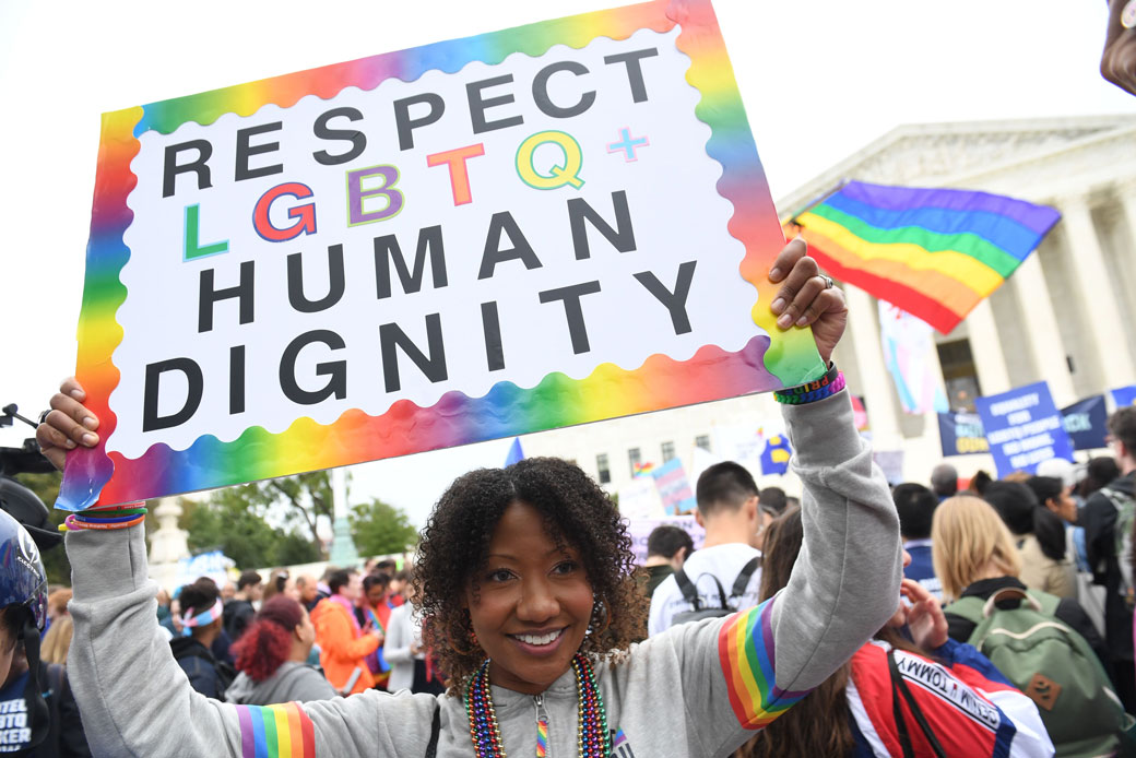  (LGBTQ rights demonstrators rally outside the U.S. Supreme Court in Washington, D.C., October 2019.)