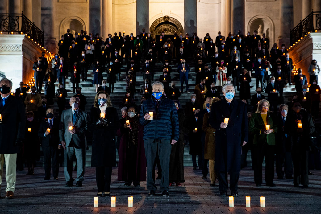 Members of Congress observe a moment of silence in memory of the 500,000 deaths due to COVID-19 on the steps of the U.S. Capitol in Washington, D.C., on February 23, 2021. (Getty/Al Drago)