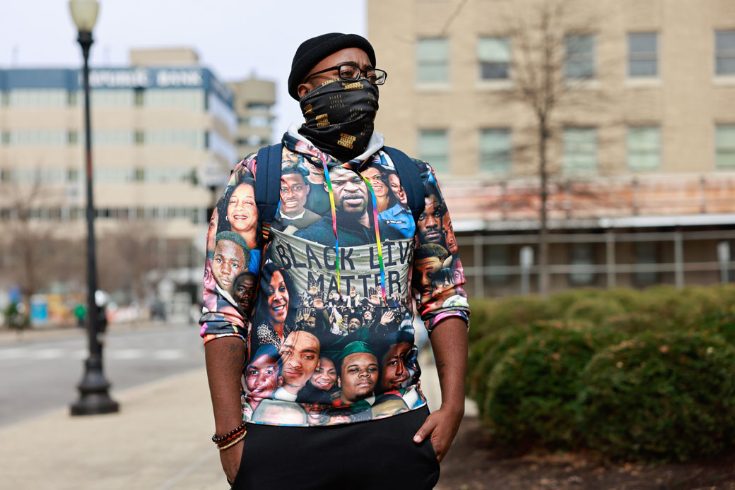 A protester wearing a Black Lives Matter T-shirt stands at a memorial event in Jefferson Square Park in Louisville, Kentucky, on March 13, 2021, to mark the one-year anniversary of Breonna Taylor's death. (Getty/Jeremy Hogan)