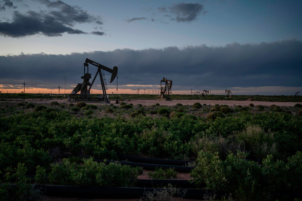 Pump jacks operate at dusk near Loco Hills on April 23, 2020, in Eddy County, New Mexico. (Getty/AFP/Paul Ratje)