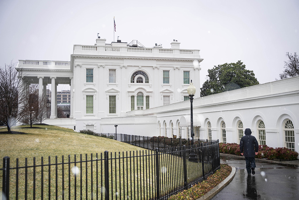 The exterior of the White House is seen during a brief snowstorm on February 7, 2021, in Washington. (Getty/Sarah Silbiger)