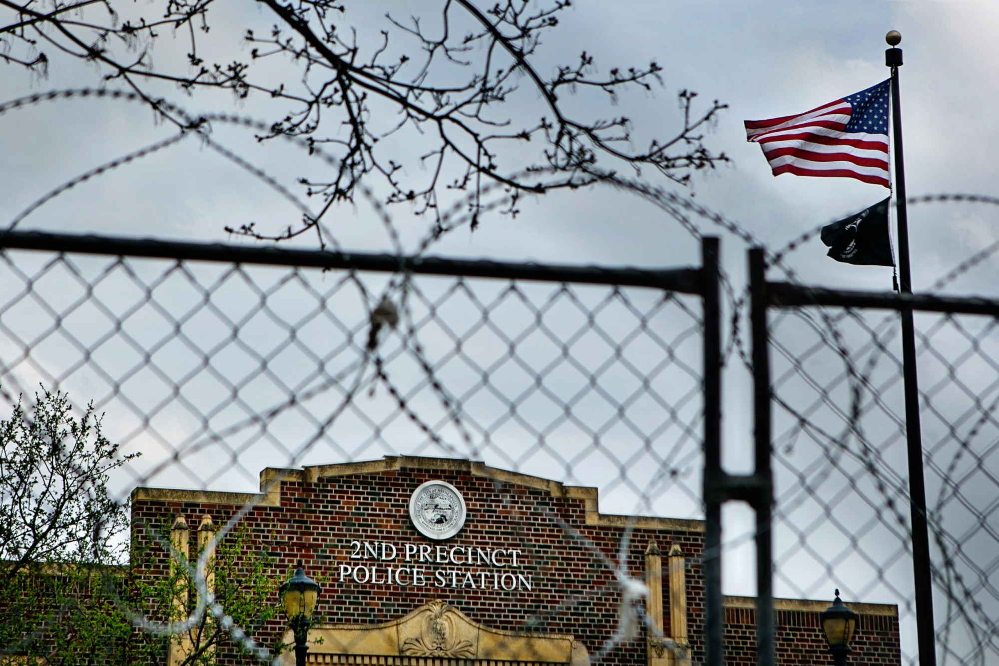 Cement barricades, barbwire, and fencing surround a police station in Minneapolis on April 7, 2021. (Getty/Los Angeles Times/Jason Armond)