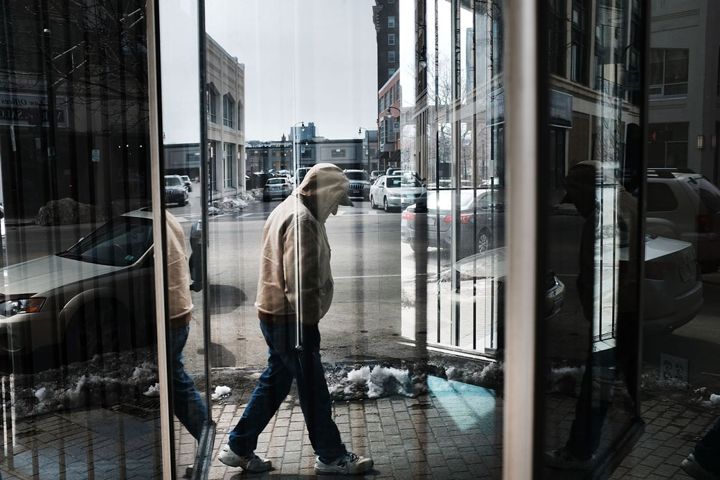 A man walks through an economically distressed section of Worcester, Massachusetts, on March 20, 2018. (Getty/Spencer Platt)