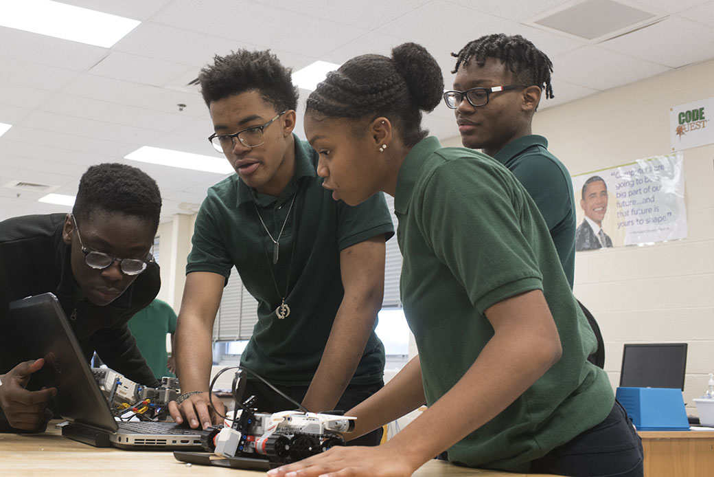 Tenth-grade students make programming adjustments to a robot that they are testing in a Computer Science Principles course at a Maryland high school, December 2017. (Getty/Marvin Joseph/The Washington Post)