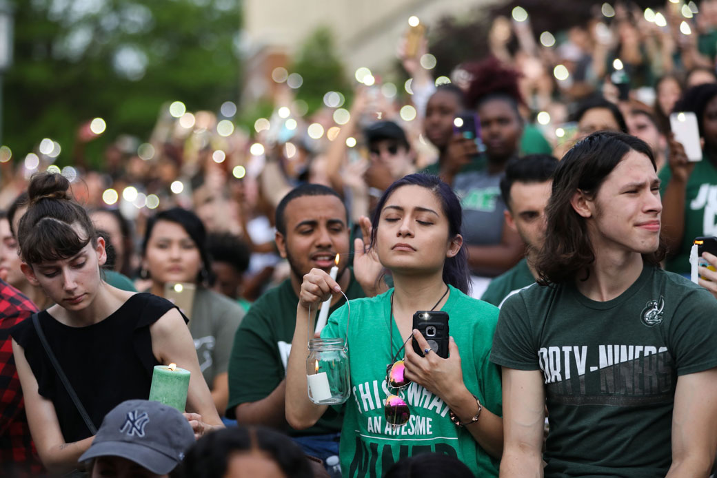 Students and faculty gather on their university quad for a candlelight vigil honoring the victims of a shooting on the University of North Carolina at Charlotte campus, May 2019. (Getty/Logan Cyrus/AFP)