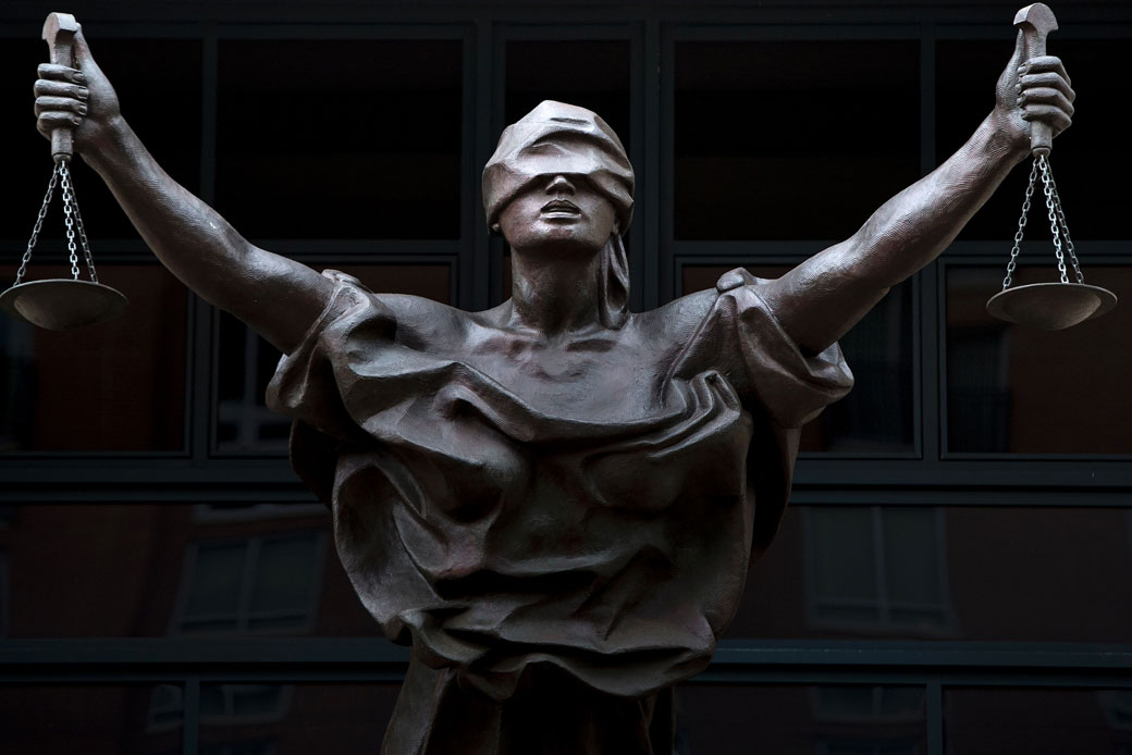 A a statue of blind justice is seen outside the Albert V. Bryan U.S. Courthouse in Alexandria, Virginia, September 2016. (Getty/AFP/Brendan Smialowski)