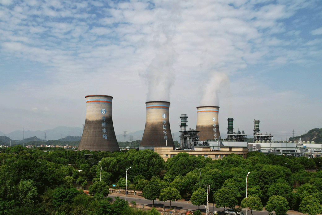 Steam billows out of chimneys of a coal-fired power plant in Hangzhou, China, on July 16, 2021. (Getty/Barcroft Media)