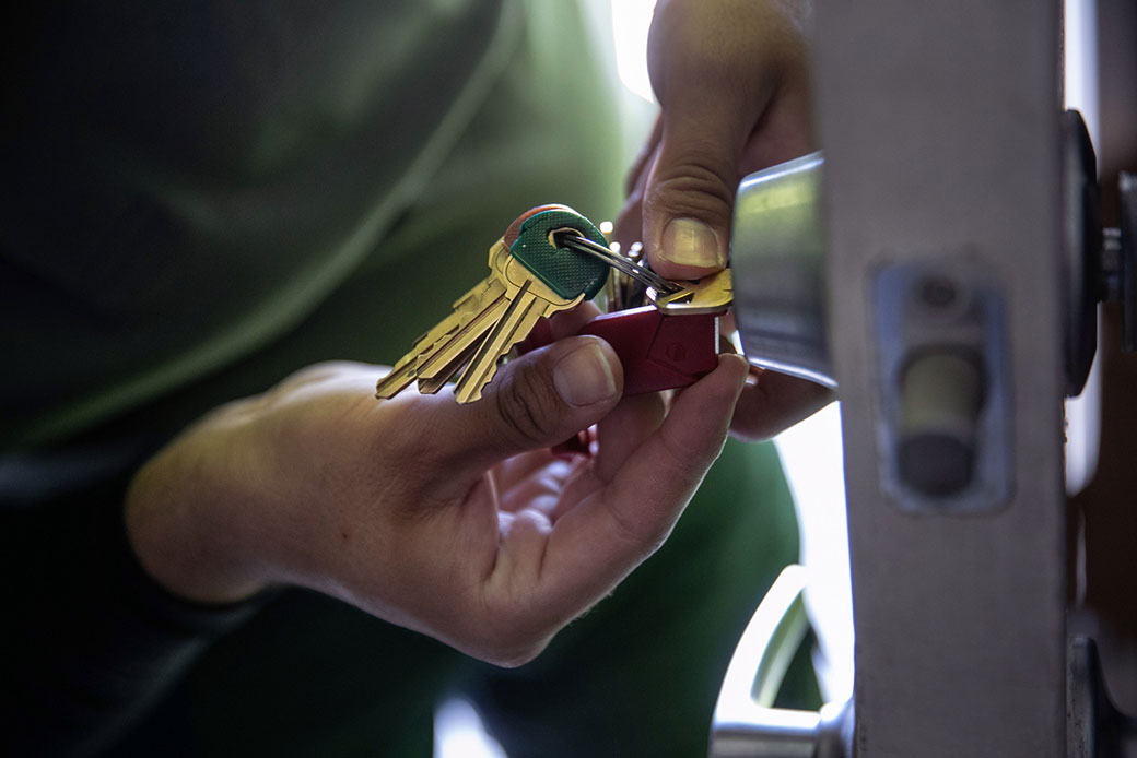  (An apartment maintenance worker changes the lock of an apartment in Phoenix after constables posted an eviction order, October 2020.)