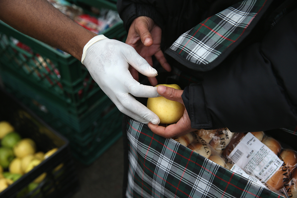 A person receives free food as part of an outreach program, December 2013, in the Brooklyn borough of New York City. (Getty/John Moore)
