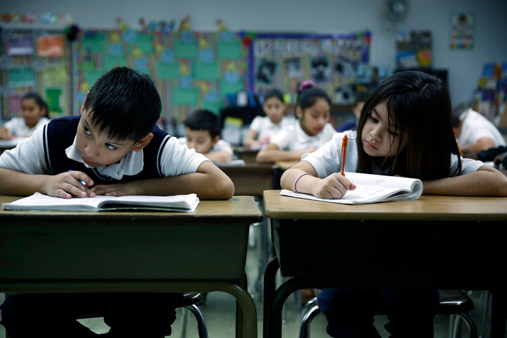  (Fourth grade students work on their math at an elementary school in Waukegan, Illinois, January 2016.)