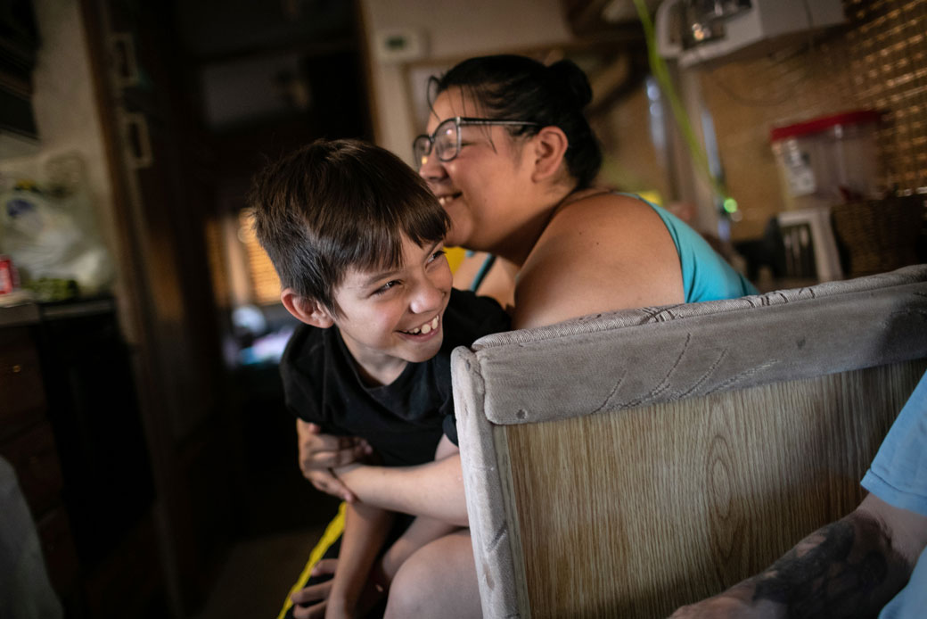 A family spends time together in their RV after narrowly escaping eviction earlier that day, on October 7, 2020, in Phoenix. (Getty/John Moore)