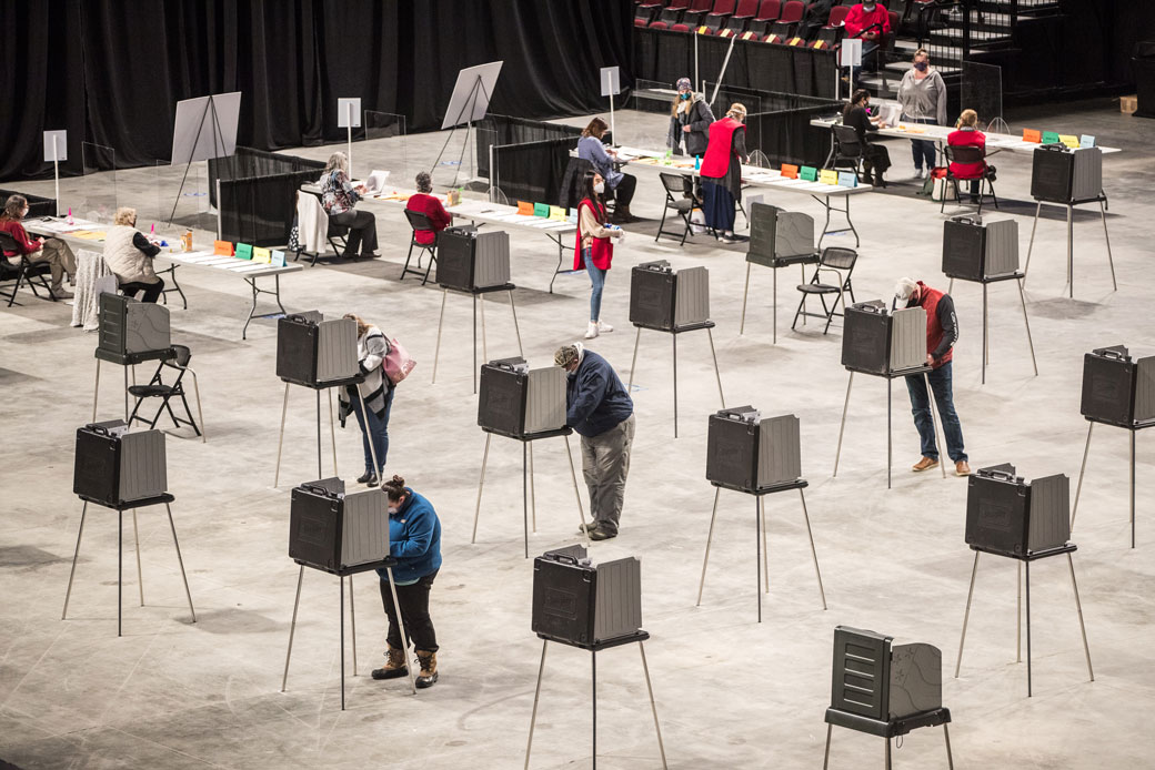 Voters fill out and cast their ballots at a polling location in Bangor, Maine, on November 3, 2020. (Getty/Scott Eisen)