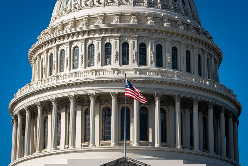 The American flag flies at the U.S. Capitol building in Washington, D.C., November 2020. (Getty/Al Drago)