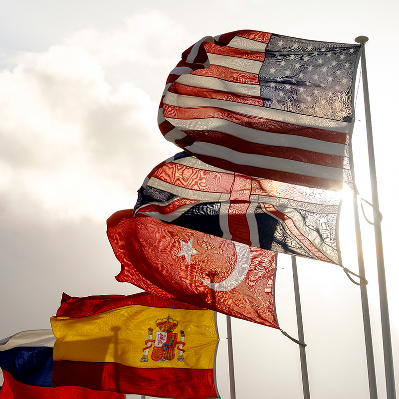 U.S. and other national flags fly outside NATO headquarters.