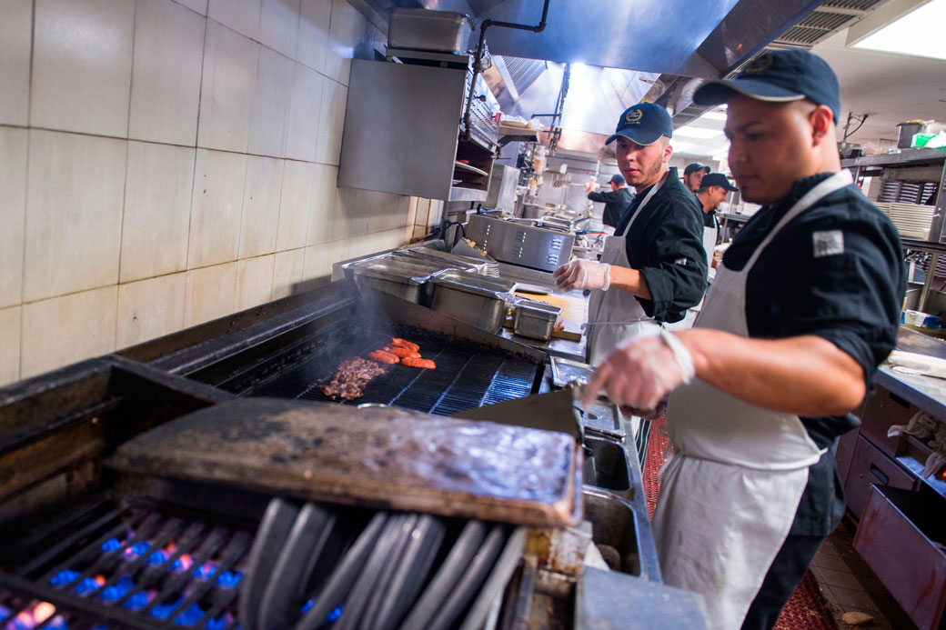 Kitchen staff prepare food in a Salvadoran restaurant in Washington, D.C., on January 11, 2018. (Getty/AFP/Andrew Caballero-Reynolds)