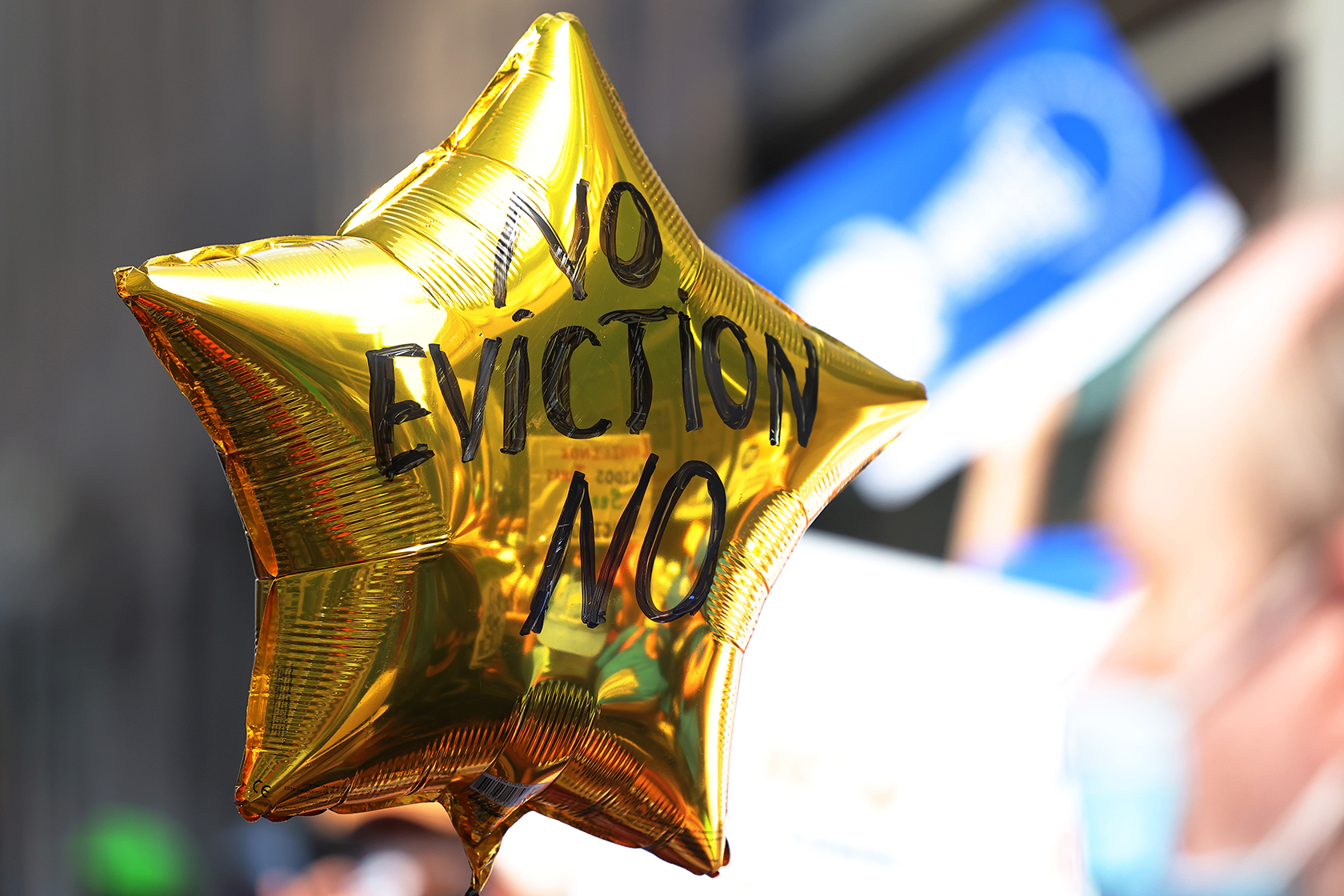 A gold balloon with anti-eviction message