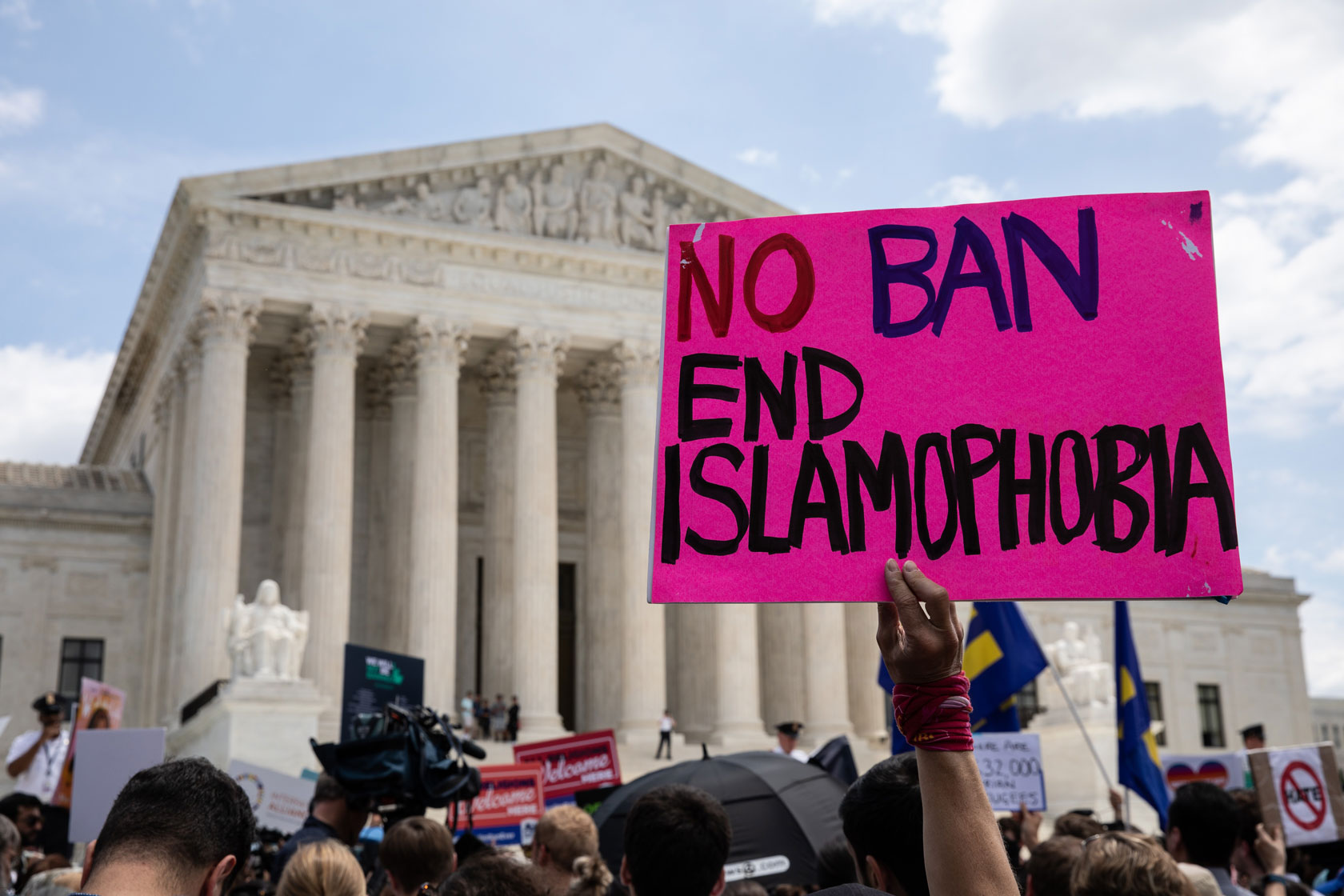 People protest the Muslim travel ban outside of the US Supreme Court in Washington, USA on June 26, 2018.